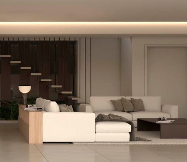 Villa Delta interior Spacious living room with modular sofa and open staircase.