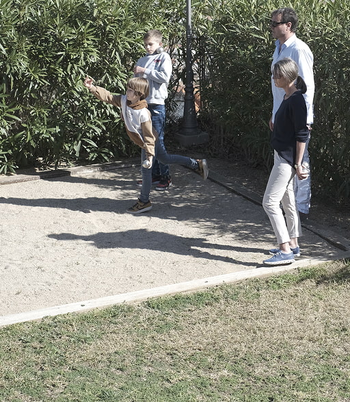 Petanque court Family playing petanque in the outdoor area of Villa de Irta